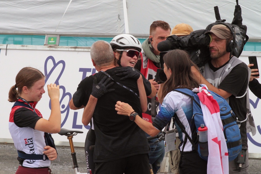 Isabella Holmgren hugged after finishing the race