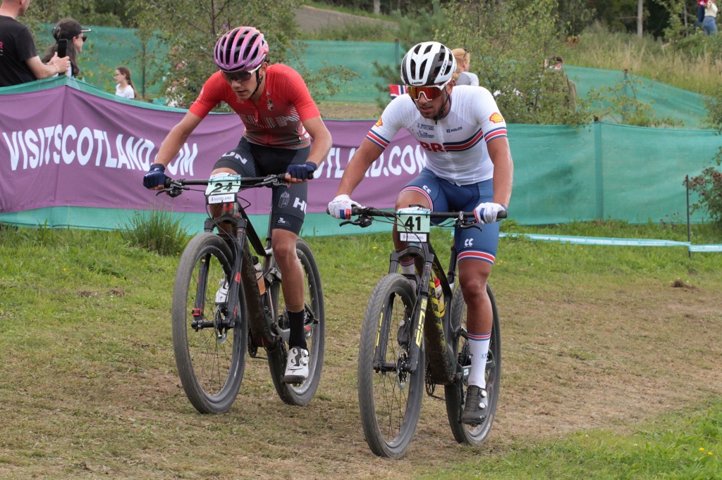 Great Britain rider max greensill and barnabas vas match each other up a hill at Glentress Forest